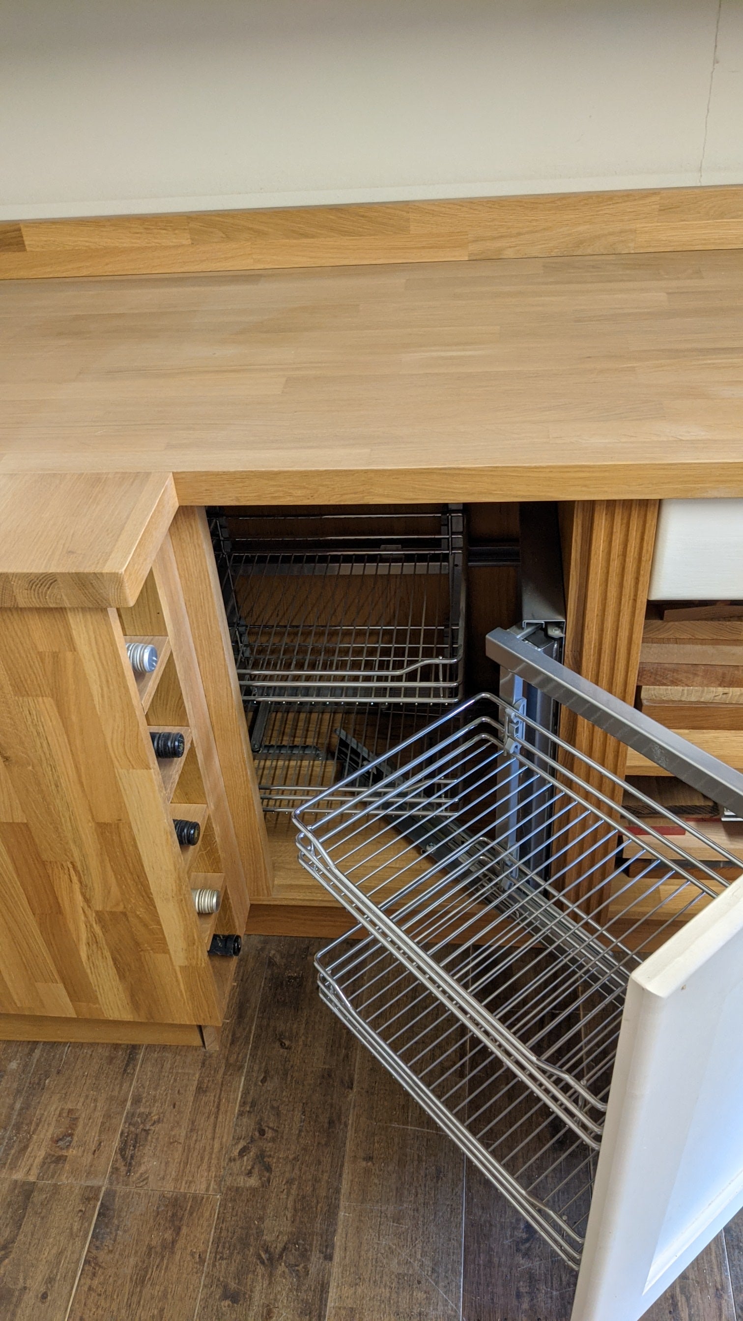 Solid Oak Kitchen with Shaker Style Doors and Metal Wirework Mechanisms